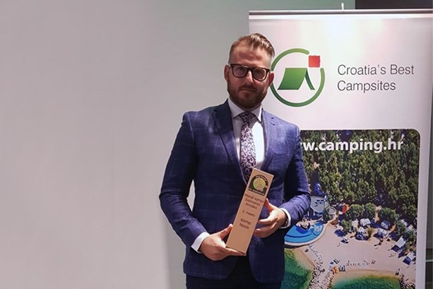 Zvonimir Tudorovic on receiving the award for the 2nd best small Dalmatian campsite, Camp Navis